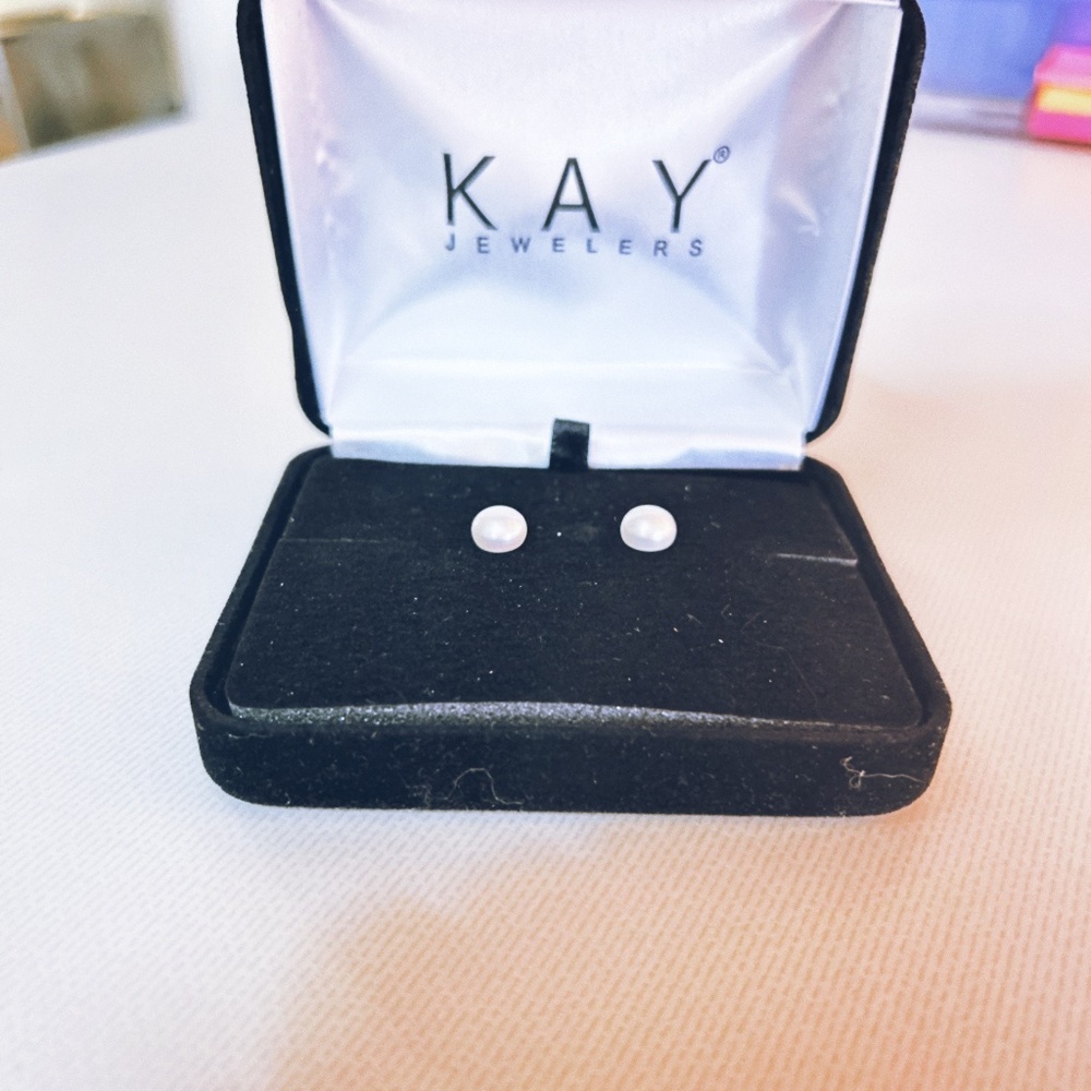 Kay Jewelers pearl stud earrings in a black box.
